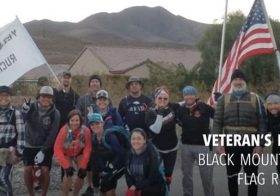 #VegasStrong Ruckers:  Veteran’s Day Flag Ruck. Kingston wears his vest, Girls 20#, Guys 30# with@johnberunning carrying the 65# flag base up the mountain. 🏽 Group : @millionburpee [instagram]