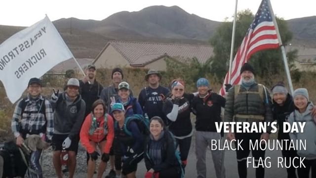 #VegasStrong Ruckers:  Veteran’s Day Flag Ruck. Kingston wears his vest, Girls 20#, Guys 30# with@johnberunning carrying the 65# flag base up the mountain. 🏽 Group : @millionburpee [instagram]